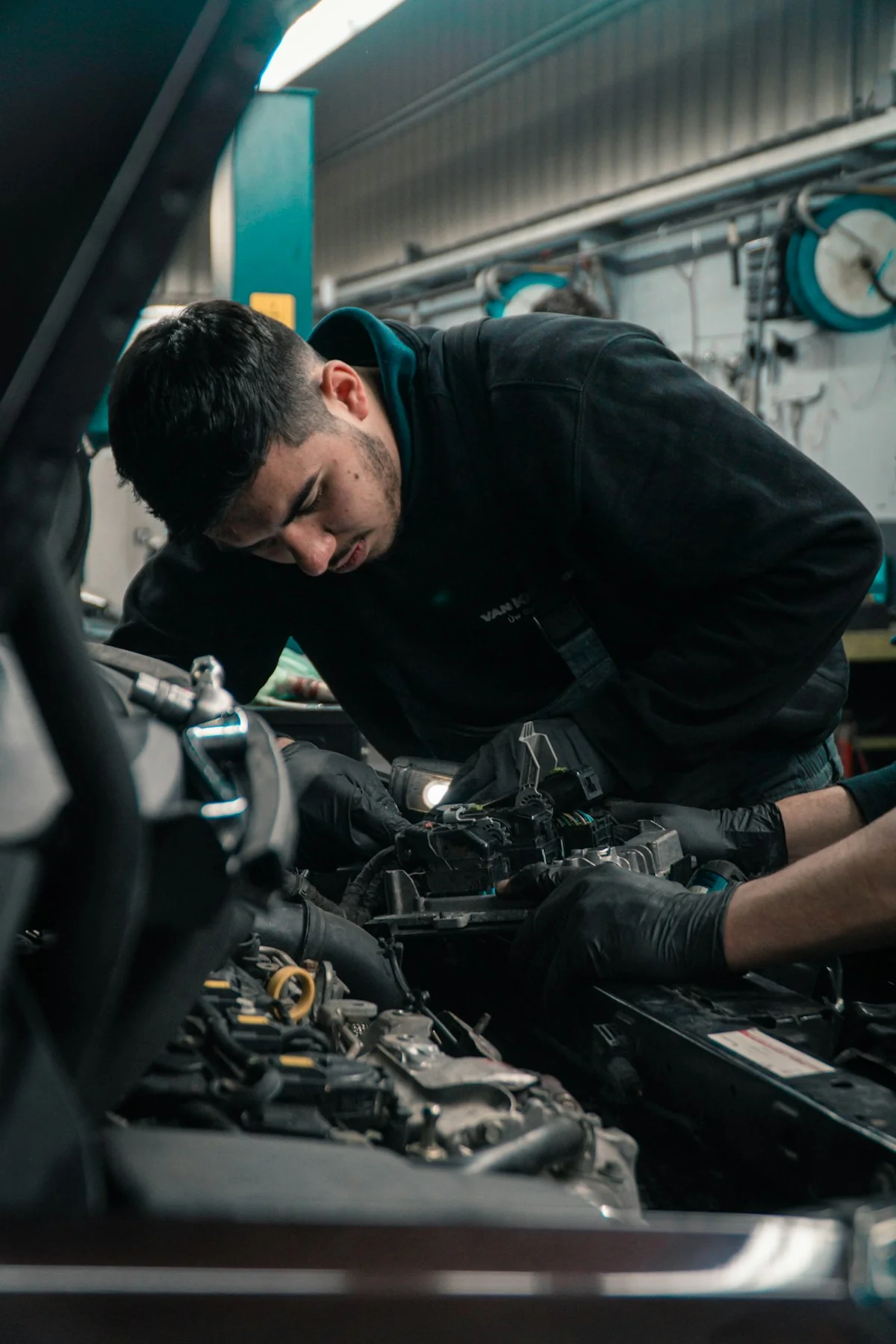 FixHive mechanic performing engine bay service in Dubai workshop