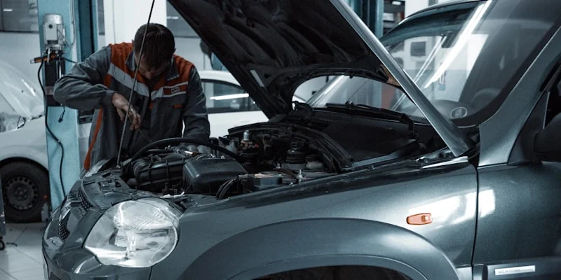 Certified mechanic performing engine diagnostic check — car service Dubai