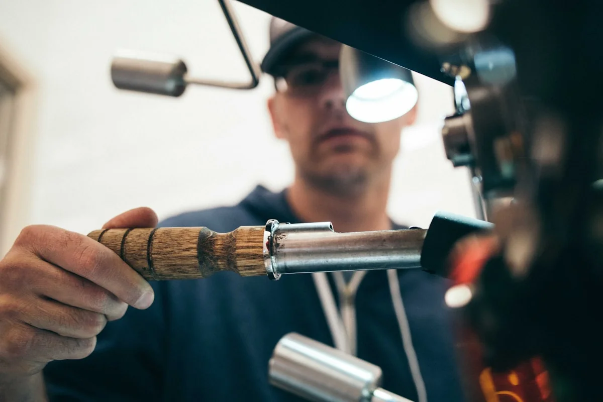FixHive mechanic using inspection torch on car components Dubai