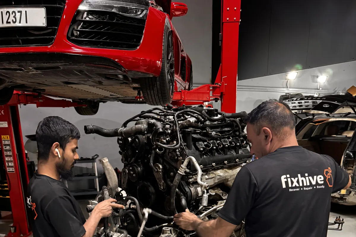 FixHive technician performing hands-on engine diagnostics at car in Dubai workshop