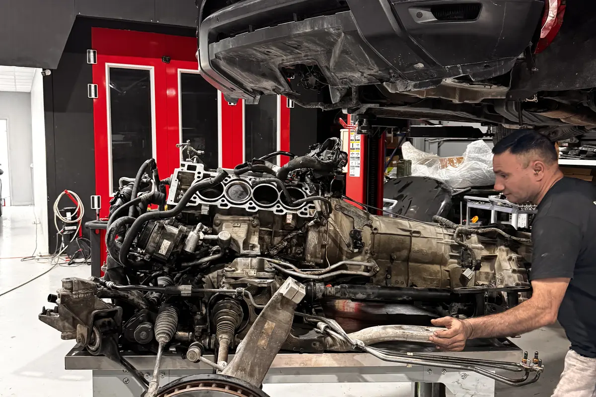 FixHive technician performing full engine removal and overhaul in Dubai DIP garage